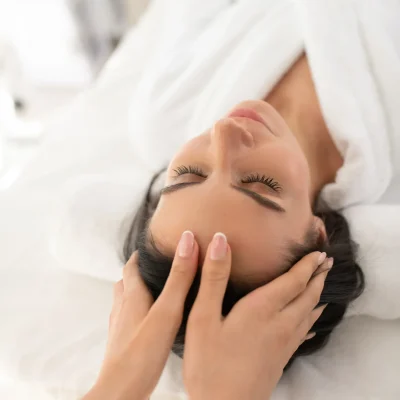 dark-haired-woman-lin-a-white-robe-having-face-mas-2024-10-16-23-24-12-utc