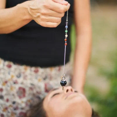 therapist-using-pendulum-during-crystal-healing-th-2025-06-06-01-44-25-utc