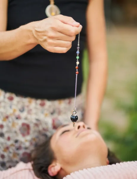 therapist-using-pendulum-during-crystal-healing-th-2025-06-06-01-44-25-utc